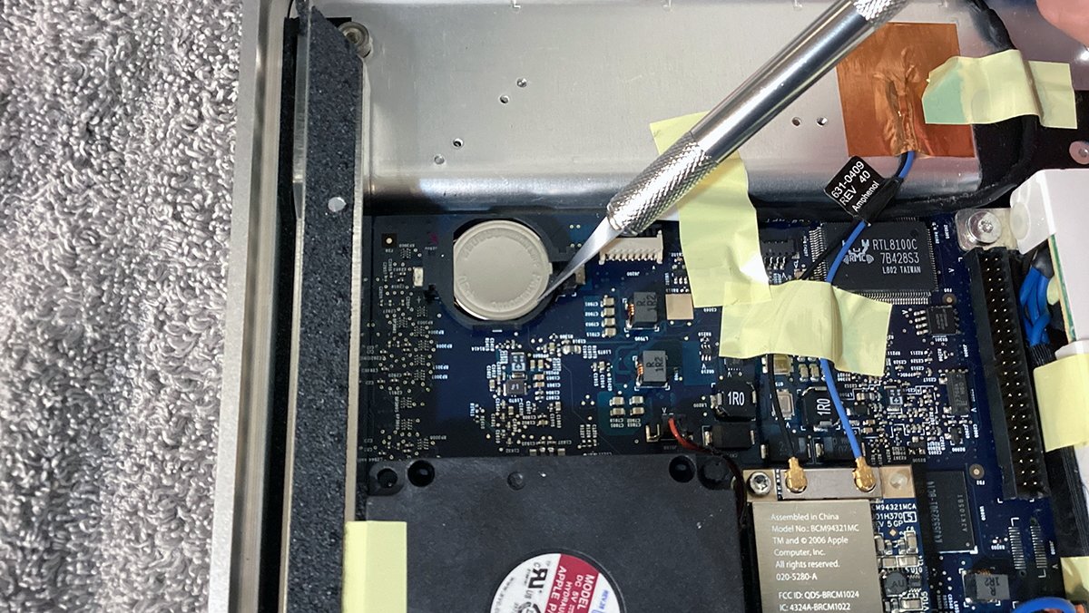 Removing the CR2032 coin-cell battery.
