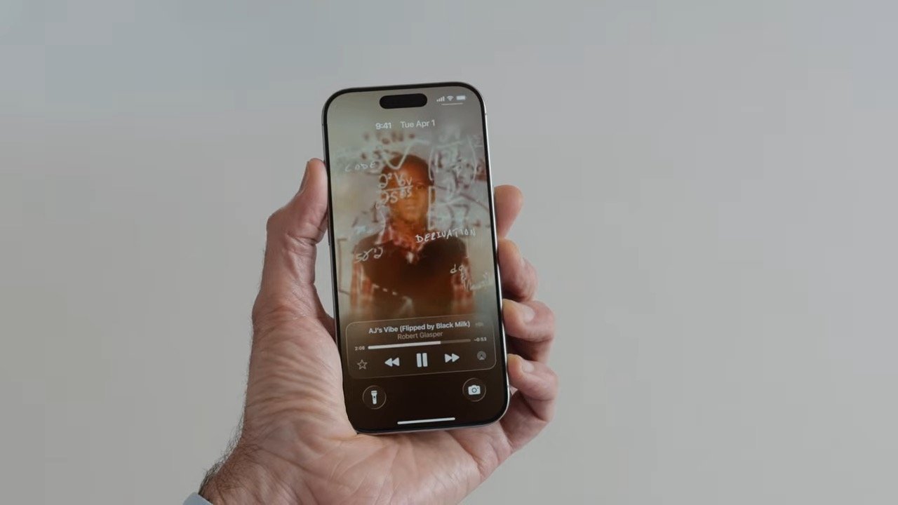 Hand holding a smartphone displaying a music player screen with album art featuring a person and handwritten annotations.